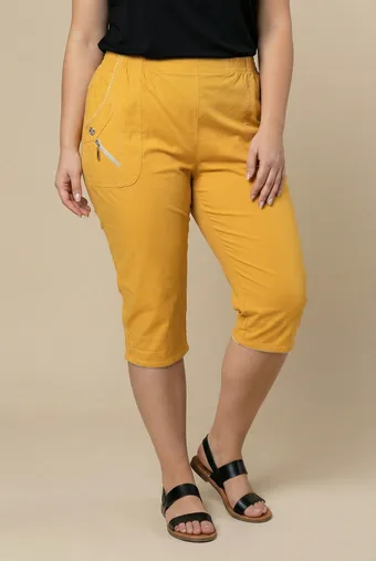 Pantaloni in viscosa gialla con tasche decorative