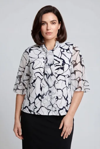copia di copia di Camicetta beige con fiocco, fantasia blu navy e pois dorati